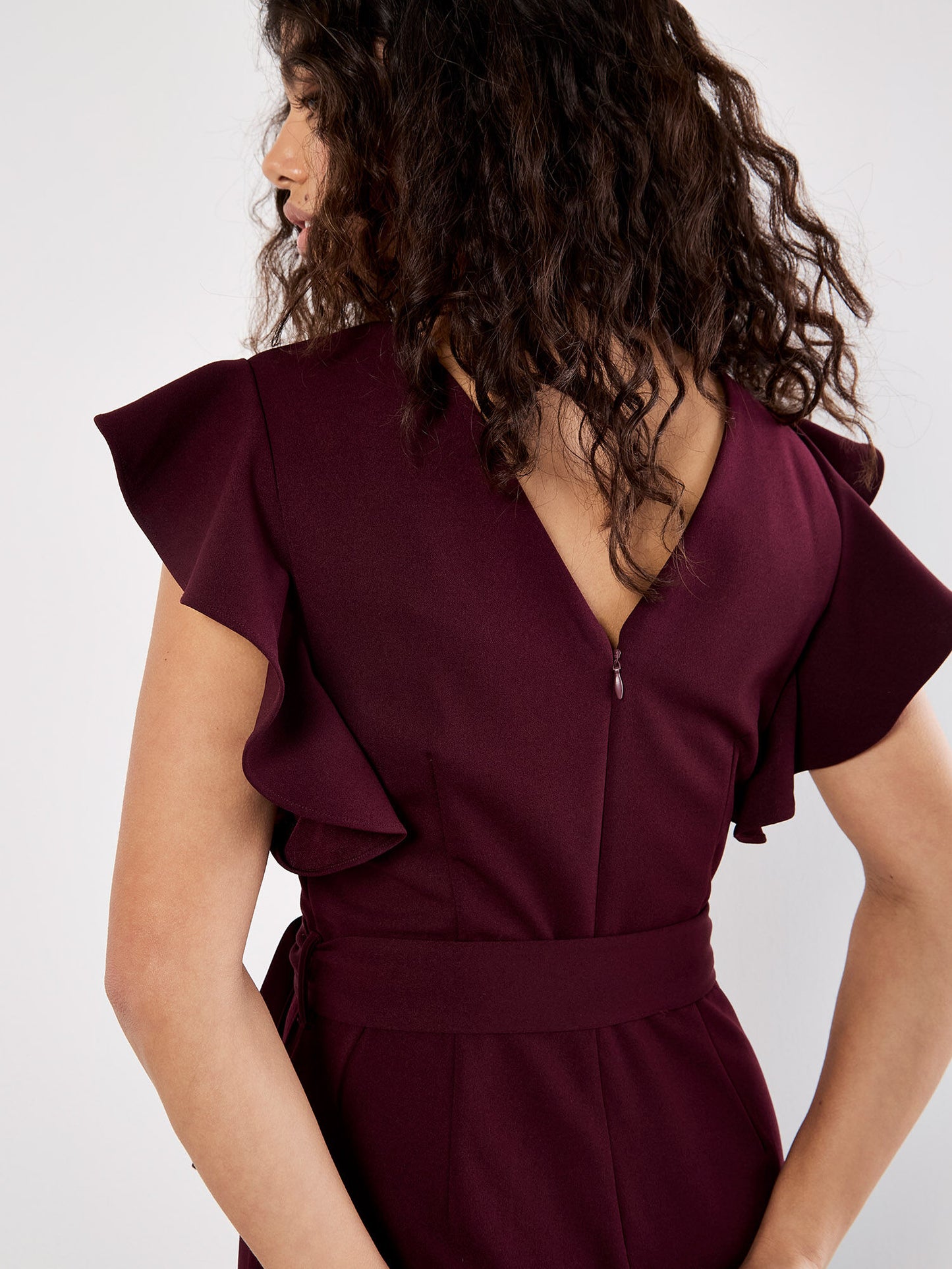 RUFFLE SLEEVE PLEAT DETAIL JUMPSUIT - BURGUNDY
